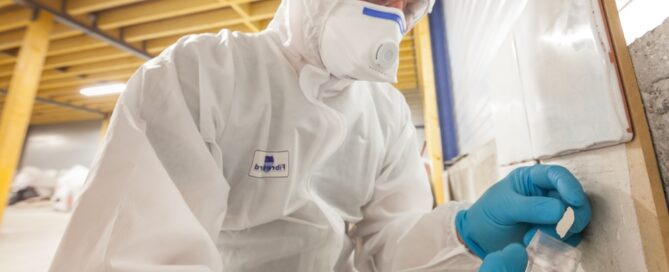 Asbestos Surveyor Taking A Sample
